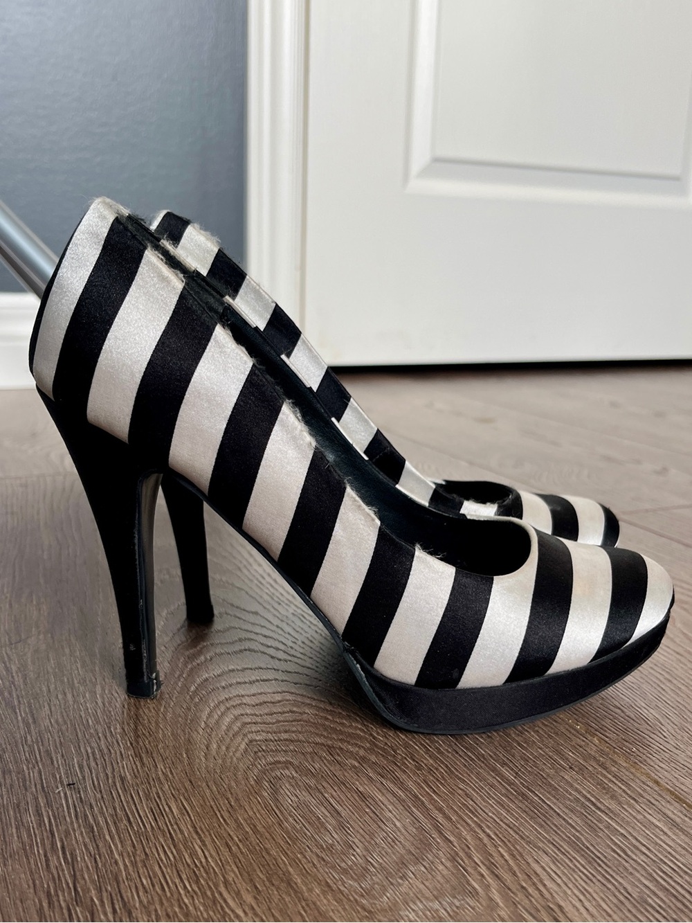 Black and white striped fabric high heels